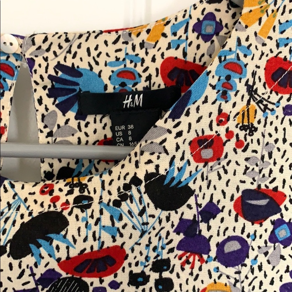 h&m floral long sleeved dress. open button back.
